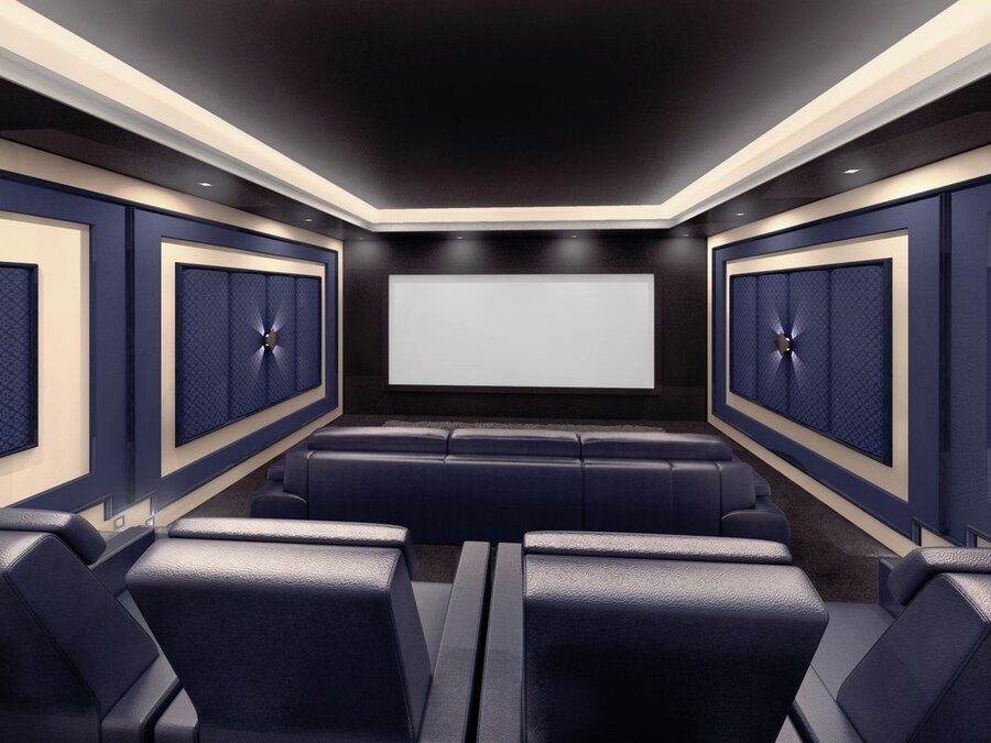 A home theater featuring a large screen, seats, and speakers via a surround sound installation.
