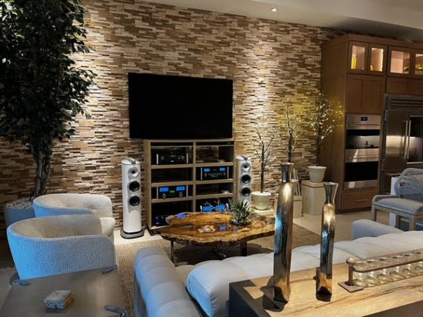 Sony OLED 77" television, a pair of B&W 804 D4 speakers with a B&W DB4S subwoofer, all hooked up with AudioQuest cables.